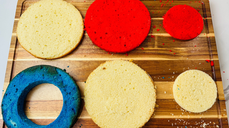 Red, white, and blue cake pieces on wooden board