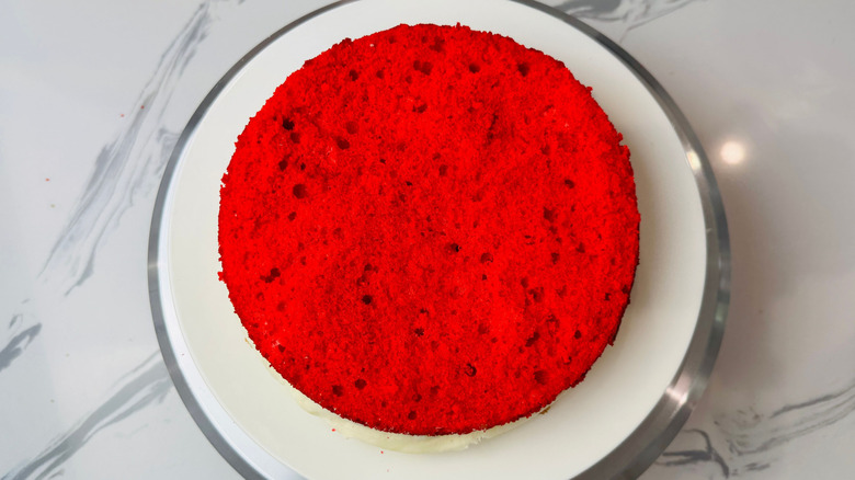 Red cake layer on plate