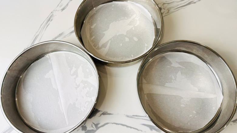 Round cake pans lined with parchment paper