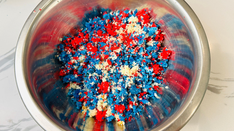 Red, white, and blue cake crumbles in bowl