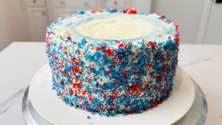 Red, white, and blue cake on stand