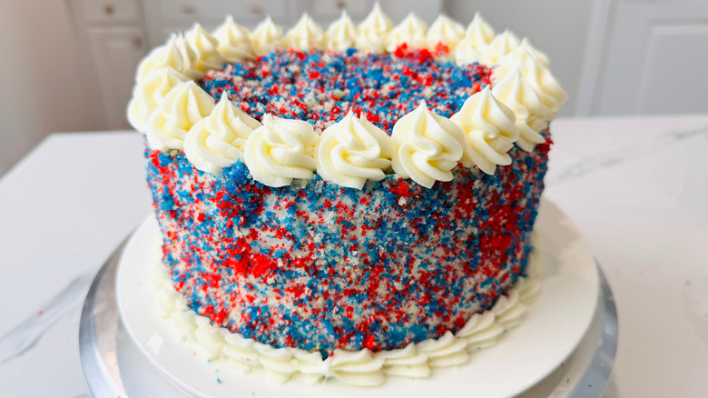Red, white, and blue cake with piped rosette borders