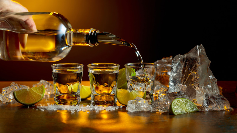 pouring tequila in shot glass