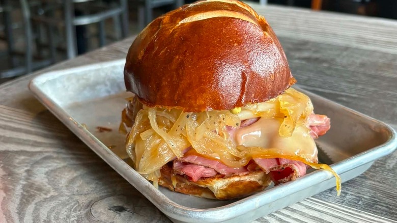 Smoked pastrami roast beef sandwich on a tray