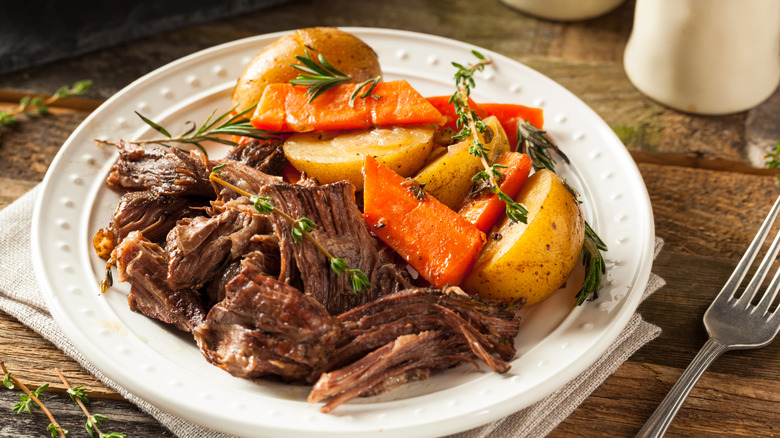 Homemade slow cooker pot roast with carrots and potatoes