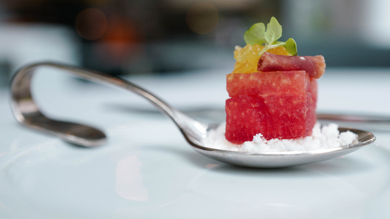 Watermelon and meat amuse-bouche in small spoon