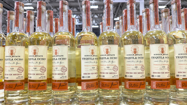 Bottles of Tequila Ocho at a store