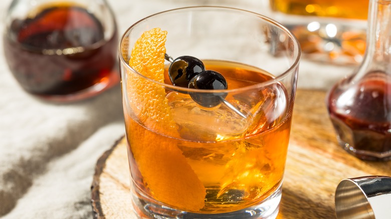 bourbon with cherries and orange peel
