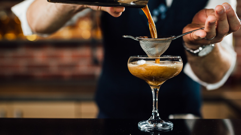 bartender pouring espresso martini