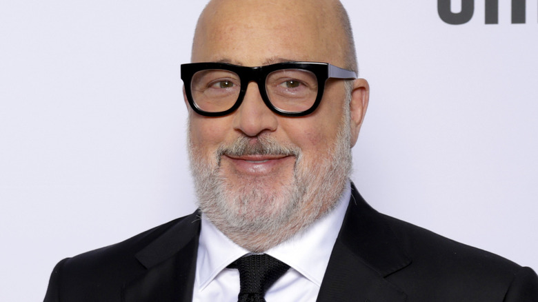 Andrew Zimmern in a suit at a carpet event