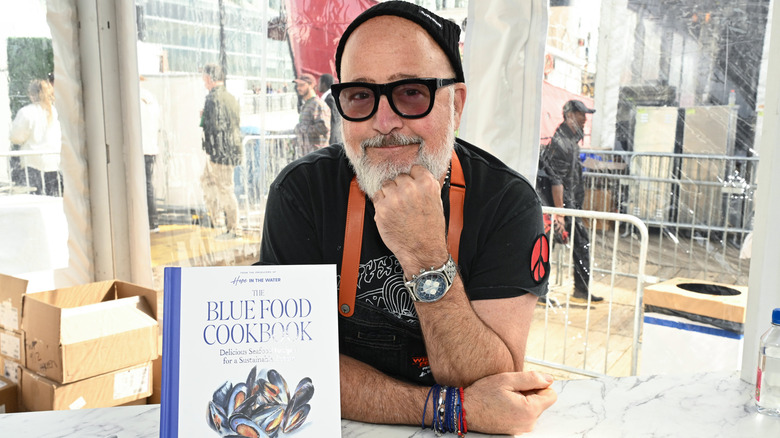 Andrew Zimmern with his sustainable seafood cookbook