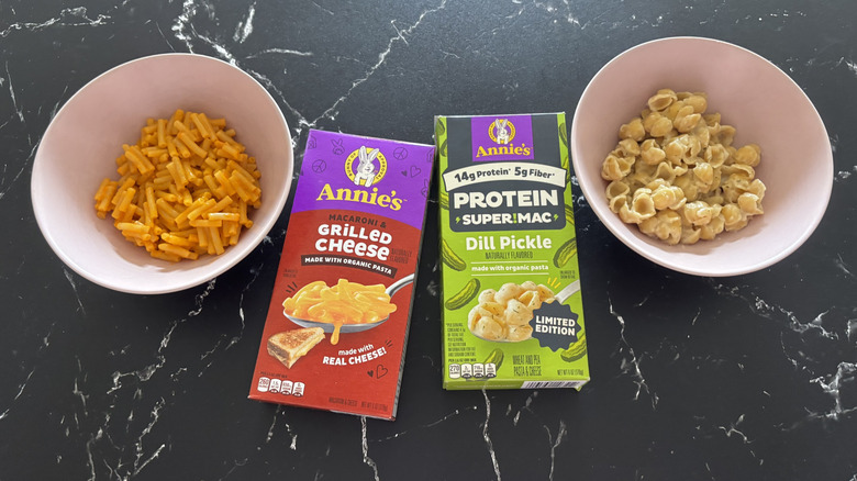Annie's mac and cheese boxes with bowls of mac and cheese on either side