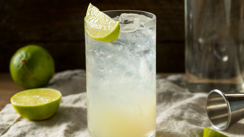 Lime Rickey in a tall glass with ice and limes.