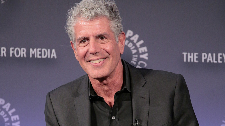 Anthony Bourdain smiling at event