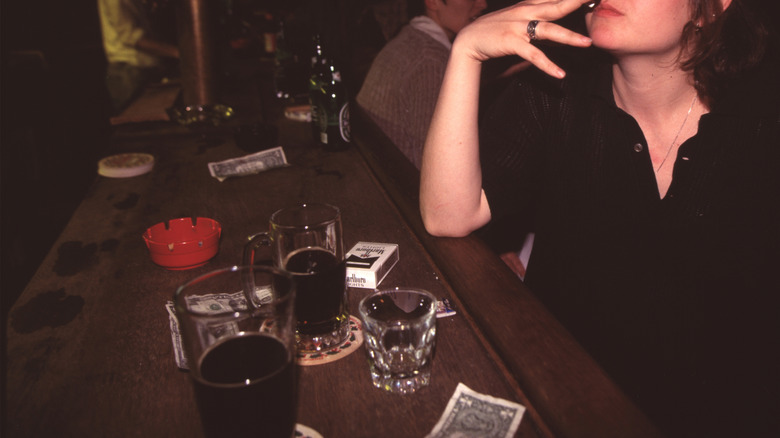 Woman smoking at Sophie's bar