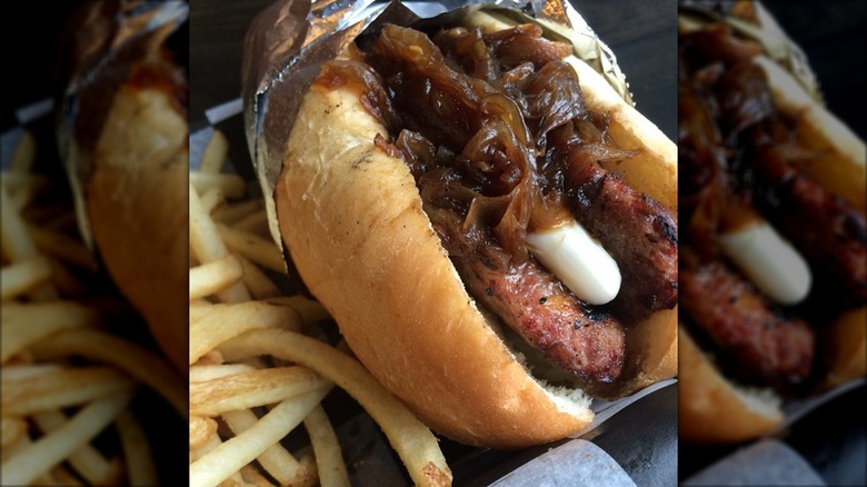 Biker Jim's hot dog with cream cheese and caramelized onions