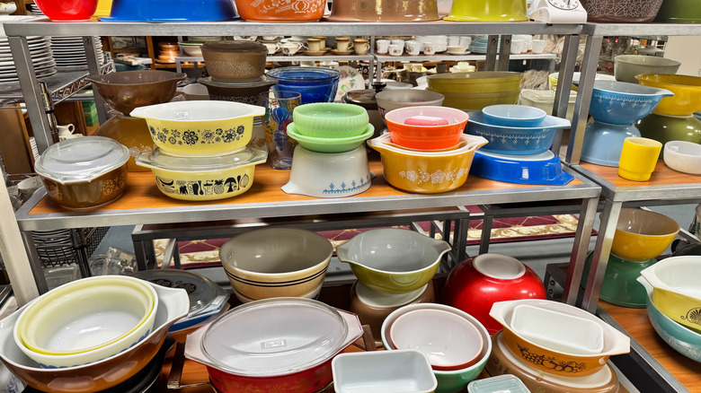 Vintage Pyrex dishes on thrift store shelves