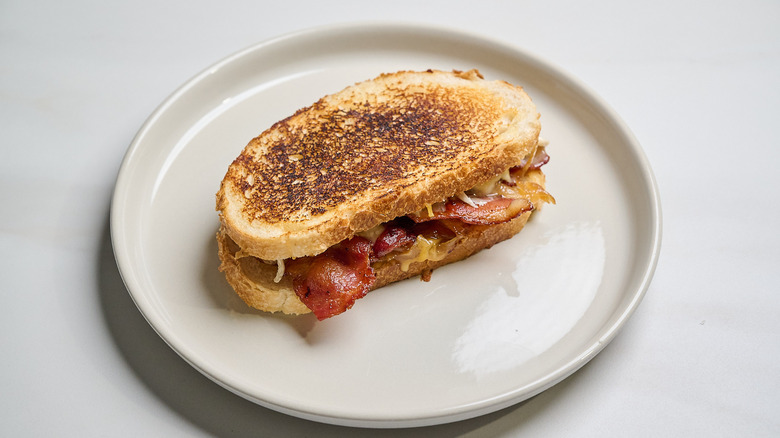 Bacon gouda grilled cheese sandwich on a plate
