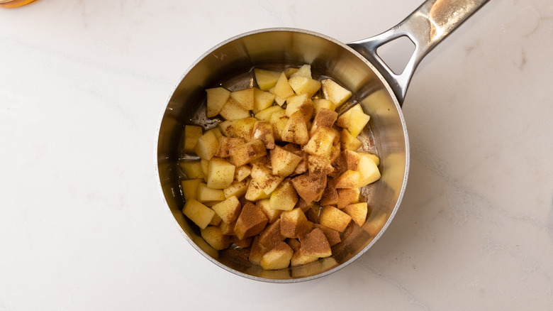 apple and spices in pan