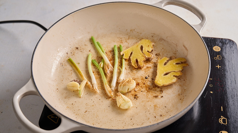 cooking the aromatics in a pan