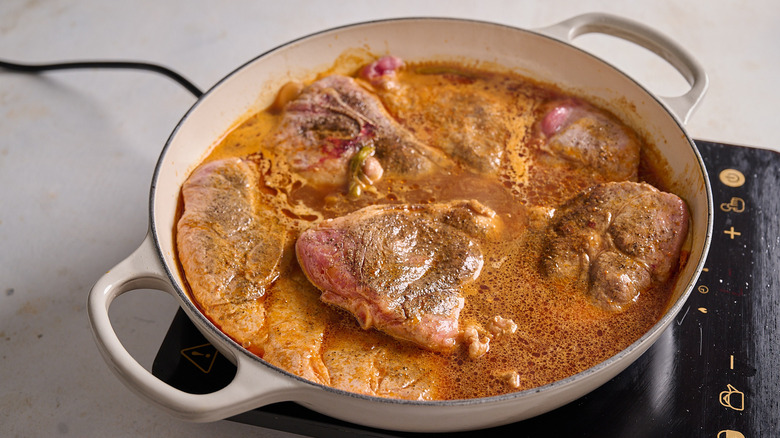 braising pork in a braising pan