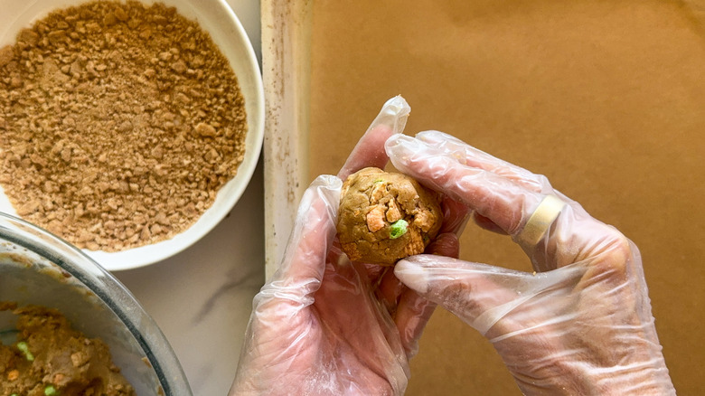 hand holding ball of dough