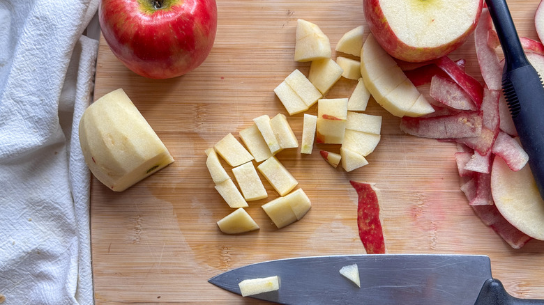 apples peeled and chopped on board