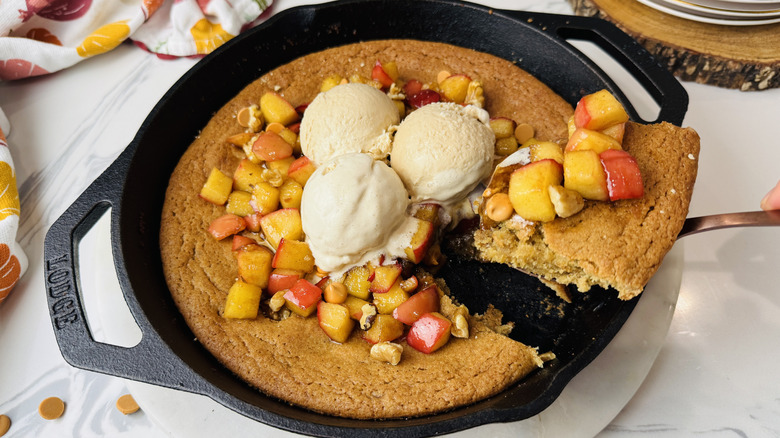 Apple blondie skillet with slice being removed