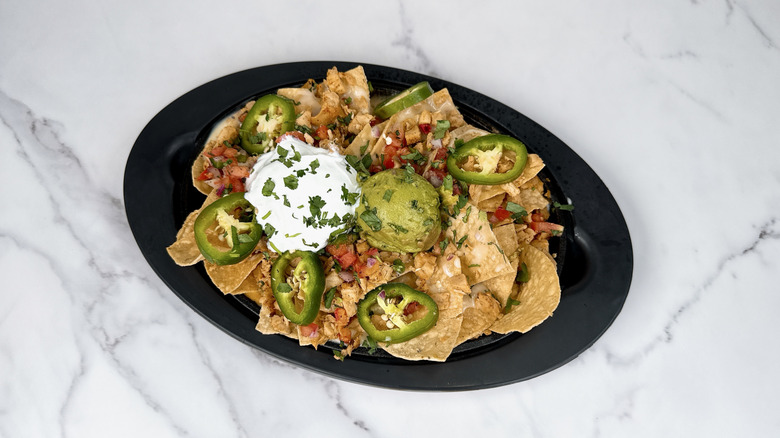 Applebee's chicken nachos in a to-go container