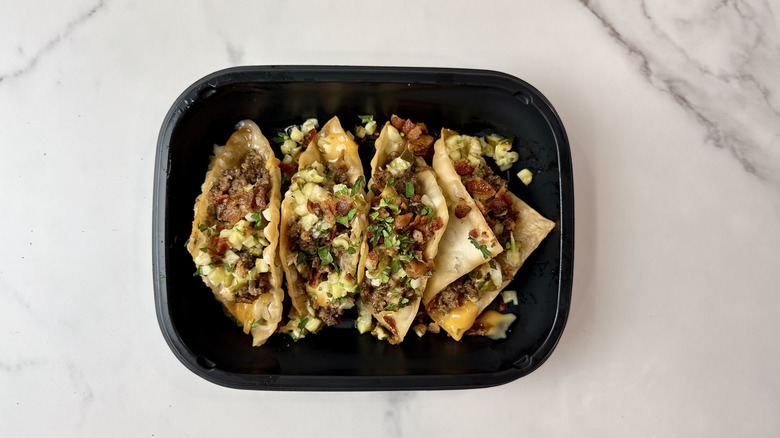 Applebee's bacon cheeseburger wonton tacos in a to-go container
