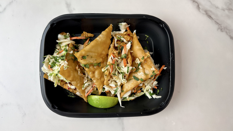 Applebee's chicken wonton tacos in a to-go container