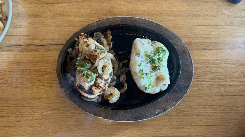 Bourbon street chicken and srhimp entree in a to-go dish