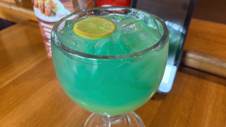 Applebees Blue Hawaiian Long Island Iced Tea on wooden table