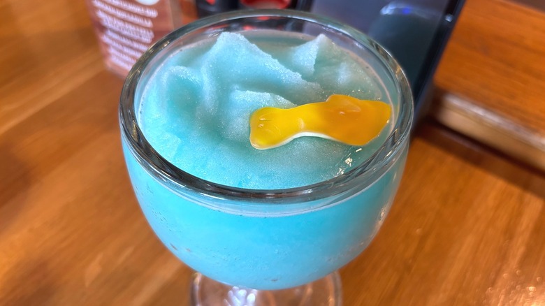 Applebees Mucho Shark Bowl cocktail on wooden table