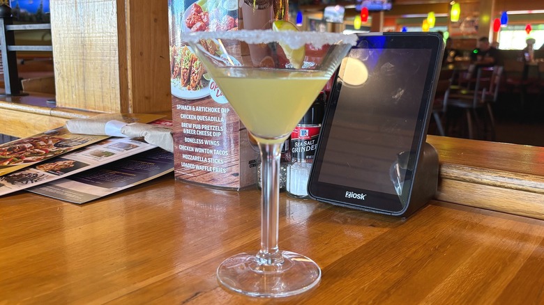 Applebees Perfect Margarita with salted rim on wooden table