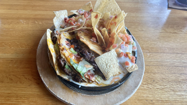 Applebee's O-M-Cheese-adilla burger and tortilla chips platter.