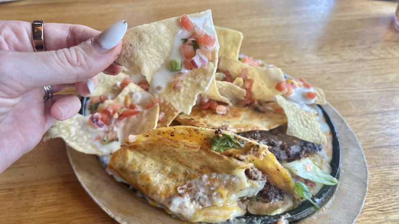 Close up of Applebee's O-M-Cheese-adilla burger and tortilla chips.