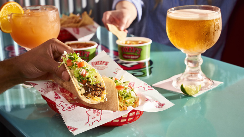 tacos from Fuzzy's Taco Shop with margarita and beer