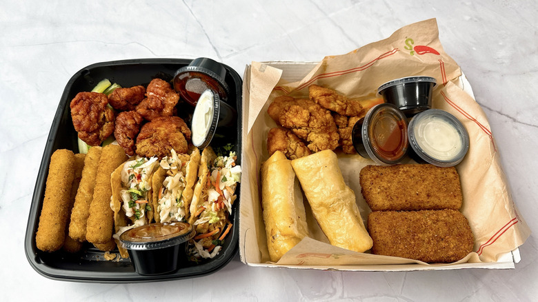 Applebee's Ultimate Trio and Chili's Triple Dipper on a marble counter