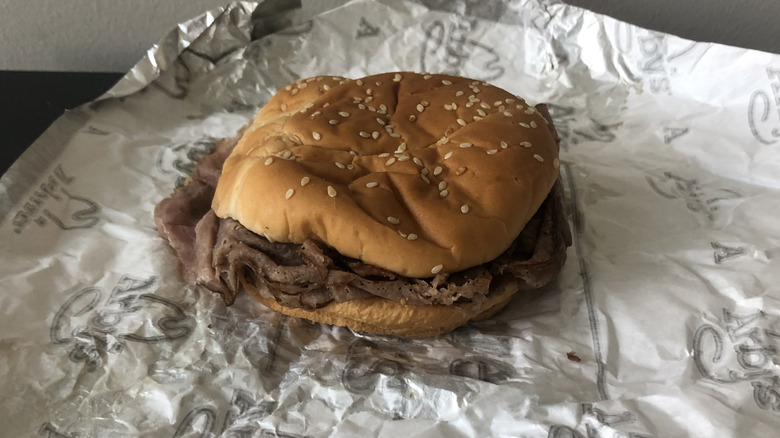 unwrapped Arby's classic roast beef sandwich on table