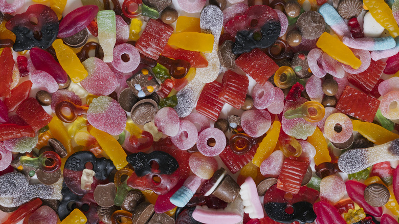 Assorted gummy candies scattered