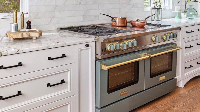 BlueStar cooking range in green with gold accents.