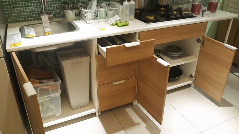 Wood grain kitchen cabinets with price tags at Ikea