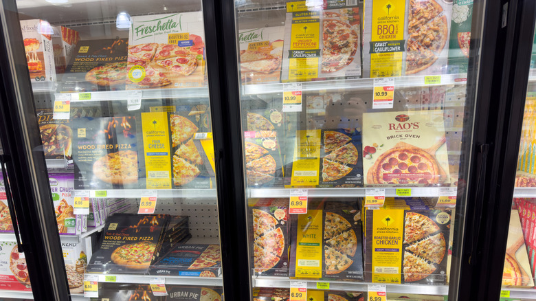 frozen pizzas in grocery display