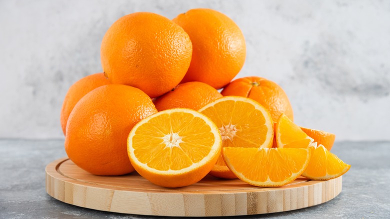 oranges on wooden board