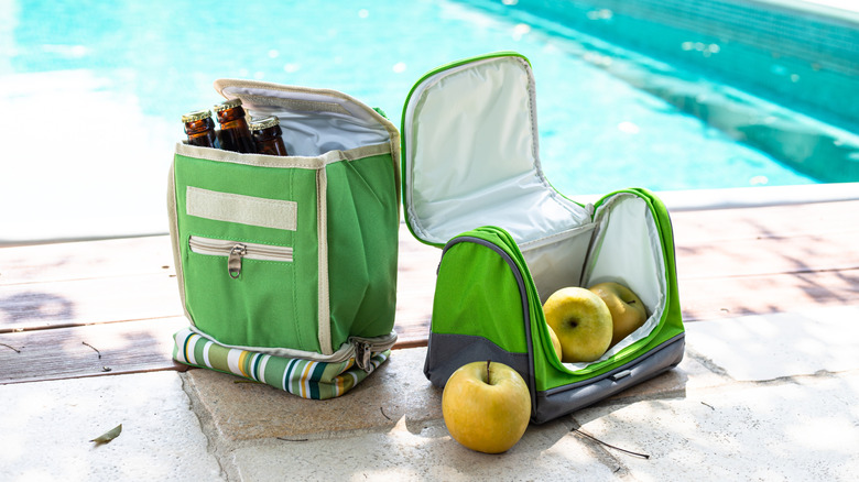 Soft-sided coolers next to pool
