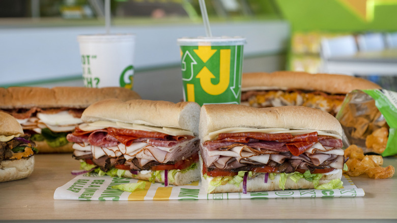 Subway sandwiches with drinks