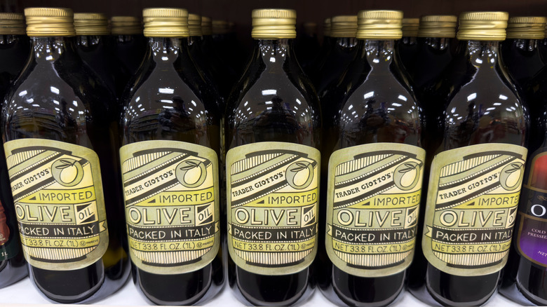 A series of bottles on a grocery shelf that says 