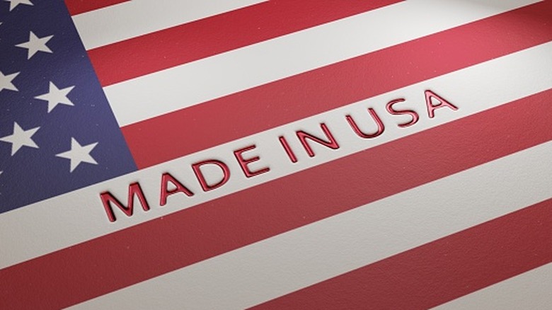 The words "MADE IN USA" printed on an American flag