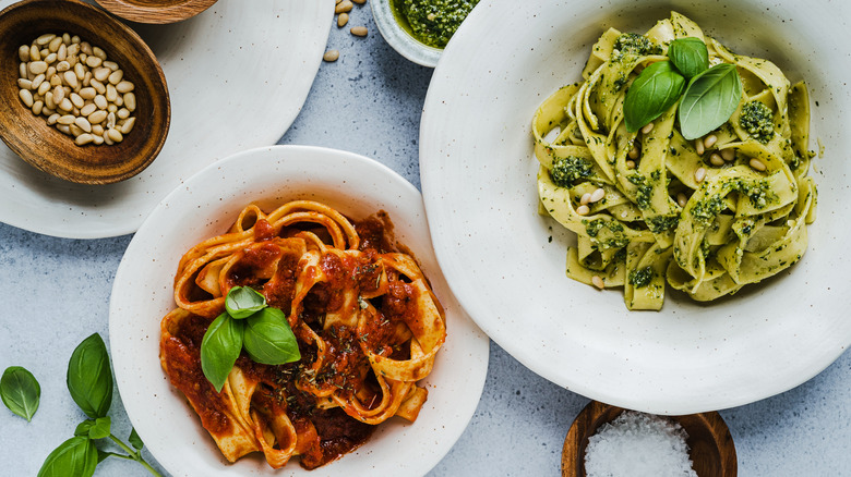 pasta dishes with meat sauce and pesto